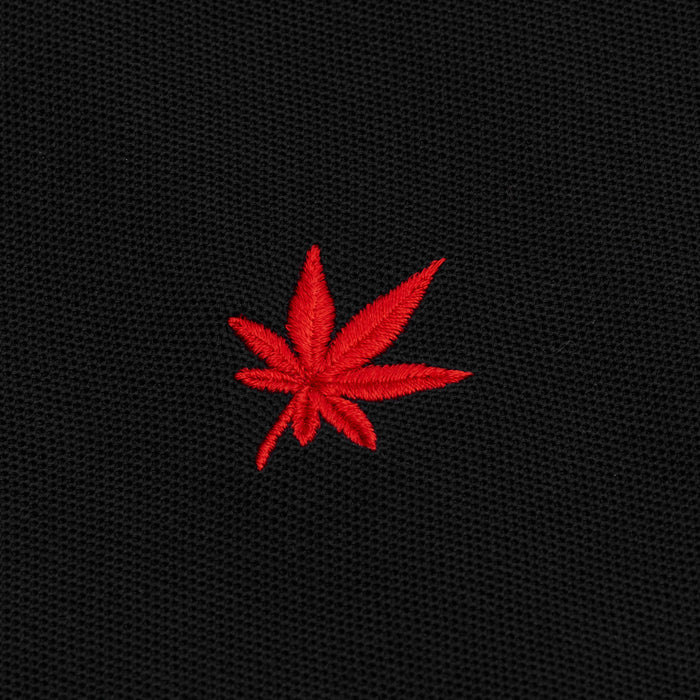 Red embroidered leaf.