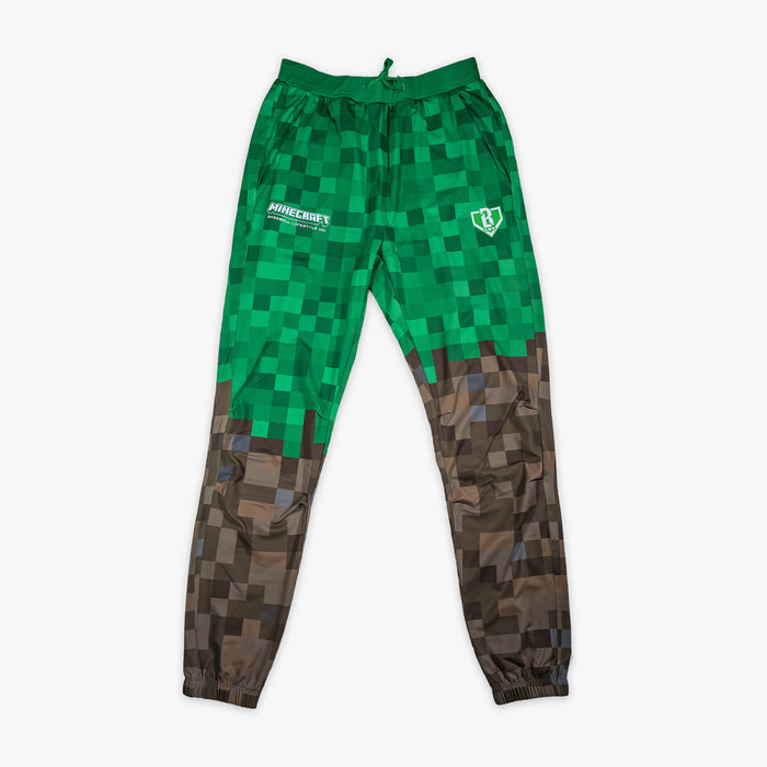 Green and brown youth pajama pants with "BL101 X Minecraft Grass Block" design — front view
