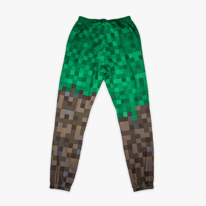 Green and brown youth pajama pants with "BL101 X Minecraft Grass Block" design — back view