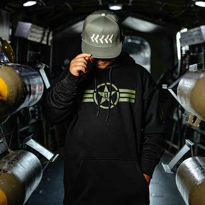 Youth model wearing black Field General BL Black youth hoodie