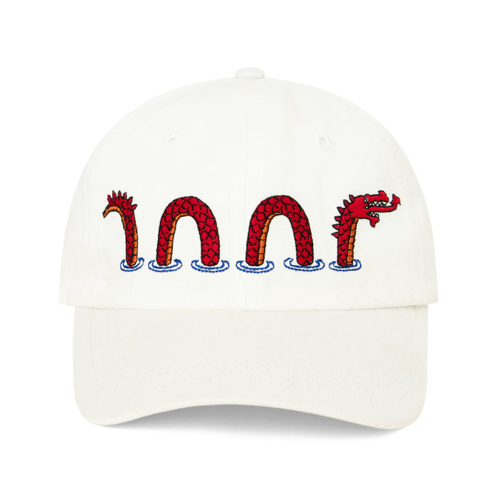 White hat embroidered with red Loch Ness Monster motif.
